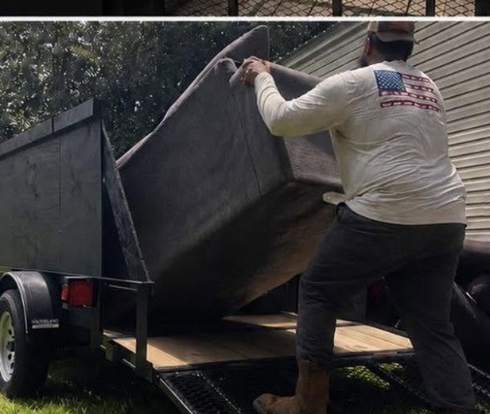 JunkAway hauling a heavy sofa